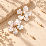Two gold-toned pearl flower stick-pin brooches with irregular petal shapes and end caps