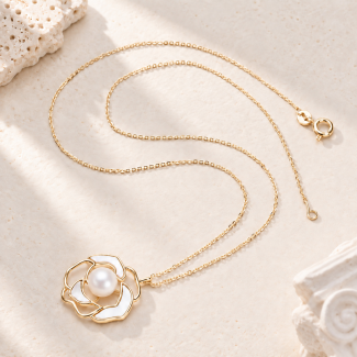 Gold-tone necklace with an open-petal flower pendant and central pearl detail