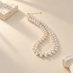 White rice pearl necklace with wheat-like paired pearl strands laid flat