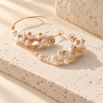Close view of open hoops with clustered petal and round pearls