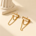 Pearl bar stud earrings with draped gold-tone chain loops laid flat
