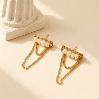 Pearl bar stud earrings with draped gold-tone chain loops laid flat