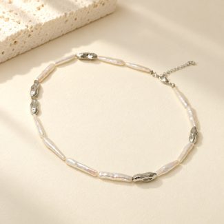 Silver-tone stick pearl collar necklace with irregular metal links laid flat