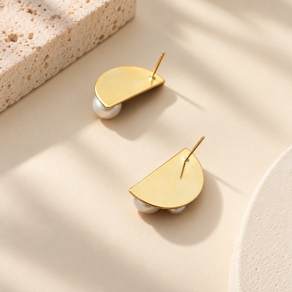 Back view of half-moon pearl crystal earrings showing the stud posts