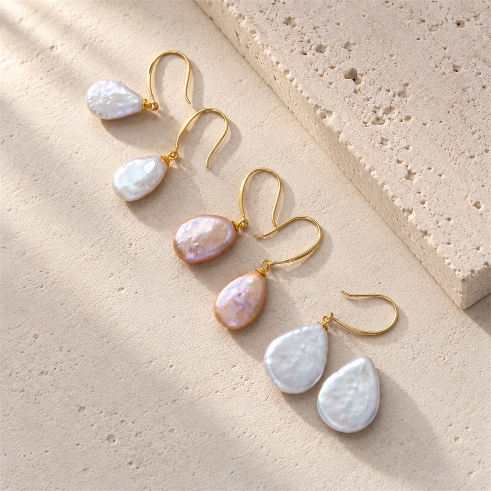 White and peach pearl drop earrings in oval and teardrop shapes with gold-toned hooks
