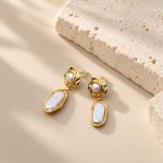 Baroque pearl earrings with small round pearls in molten-style golden settings