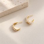 Side view of freshwater pearl crescent stud hoop earrings showing the post fastening