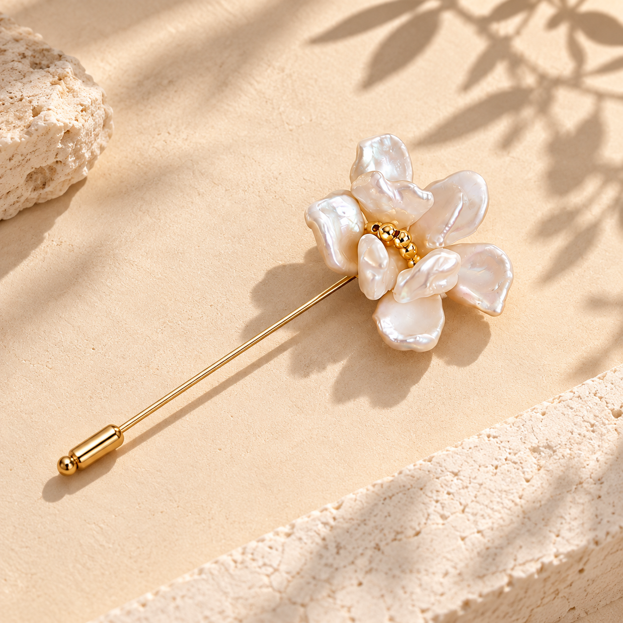 Gold-toned pearl flower stick pin with layered pearl petals and a small beaded center