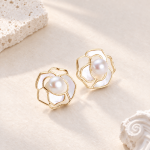 Matching open-petal flower stud earrings with pearl centres