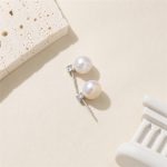 Back view of silver-toned freshwater pearl stud earrings with posts