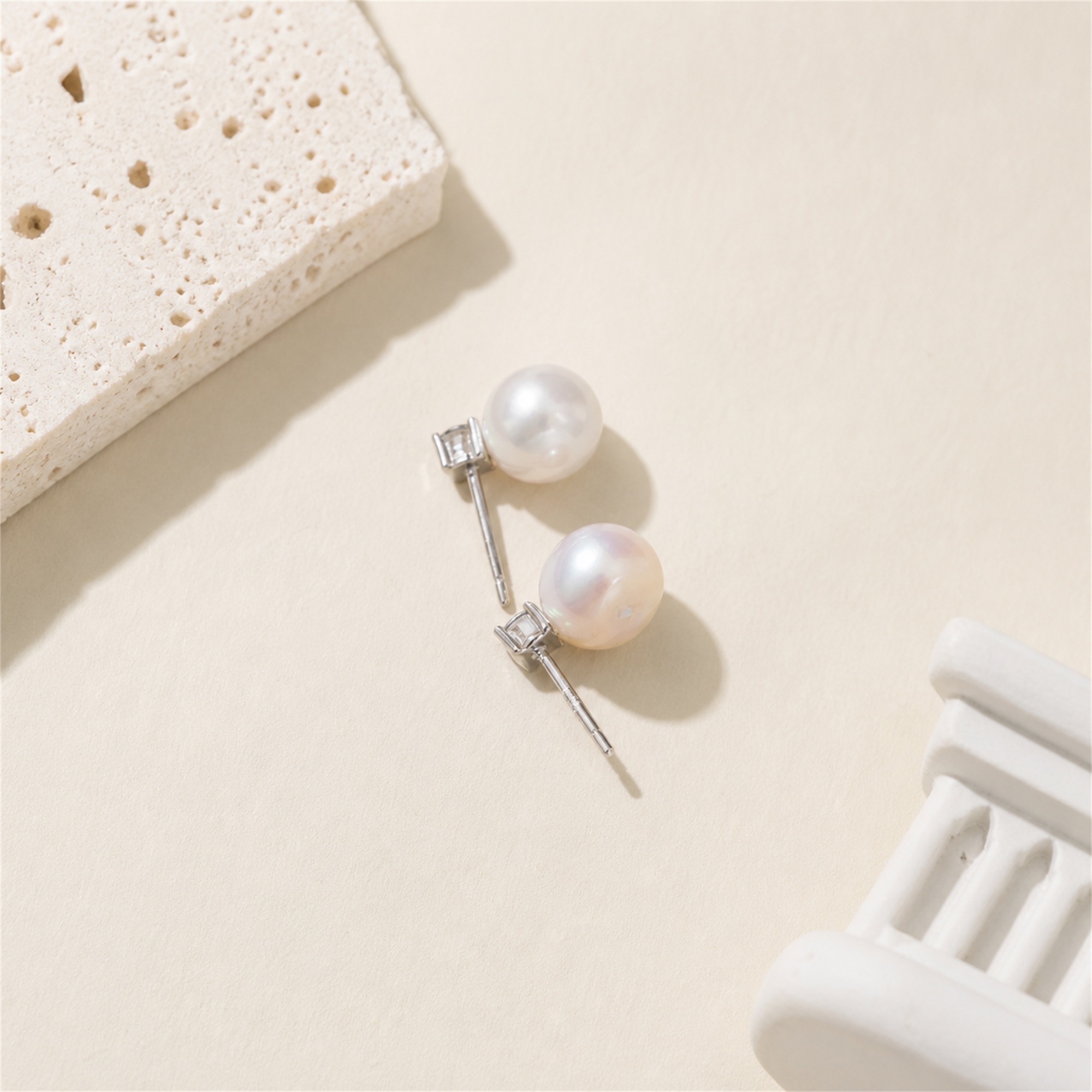 Back view of silver-toned freshwater pearl stud earrings with posts