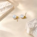 Back view of gold-toned freshwater pearl stud earrings with posts