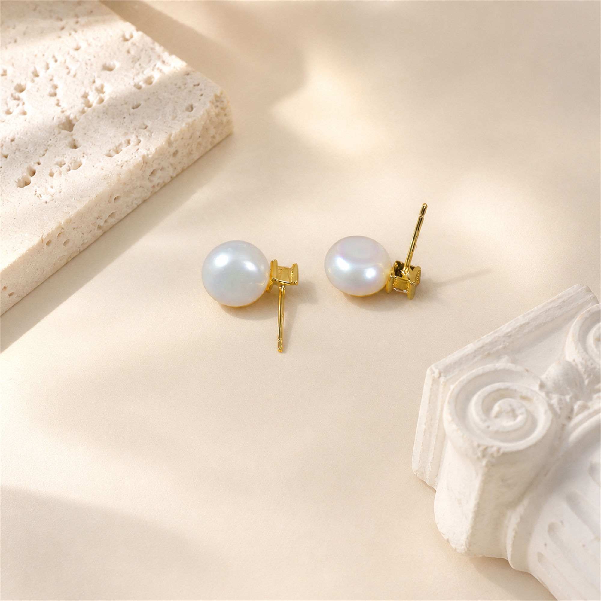 Back view of gold-toned freshwater pearl stud earrings with posts