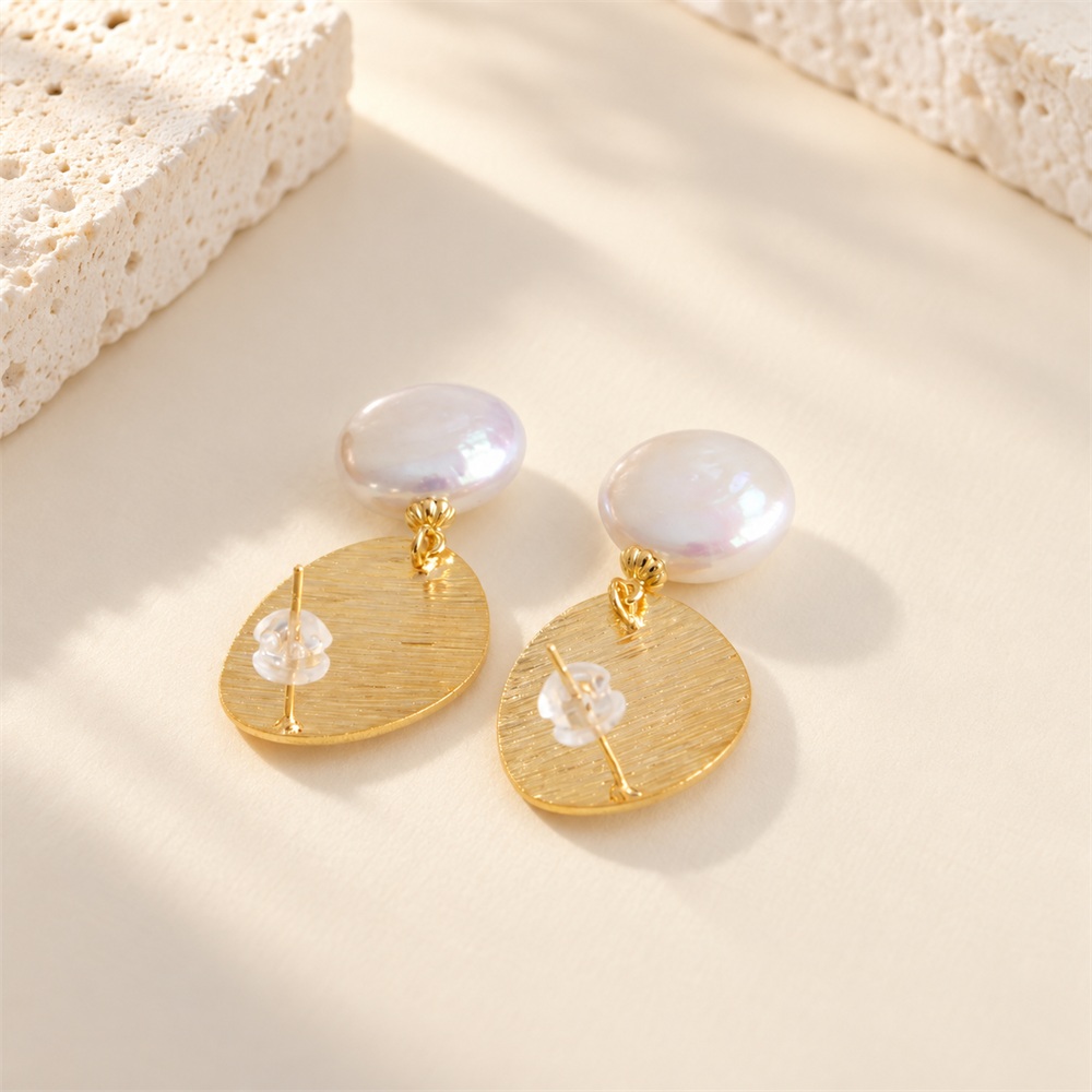 Back view of brushed disc pearl earrings showing stud posts and pearl drops