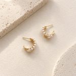 Pair of freshwater pearl crescent stud hoop earrings in a front view