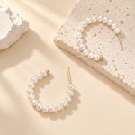 Close-up of freshwater pearl hoops showing open ends, stud posts and rows of small pearls
