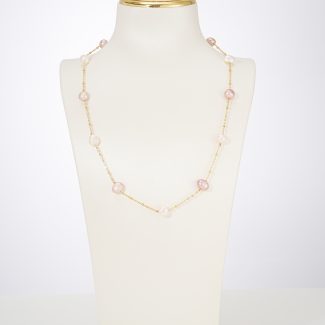 Pink and white freshwater pearl station necklace on a display bust