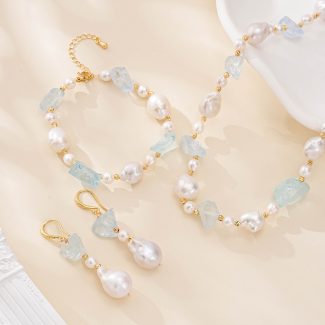 Raw aquamarine and baroque pearl necklace, bracelet and drop earrings arranged as a matching set