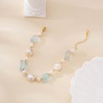 Aquamarine and baroque pearl bracelet arranged in a curve with gold-toned clasp
