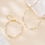 Engraved gold-tone bar and freshwater pearl necklace and bracelet set