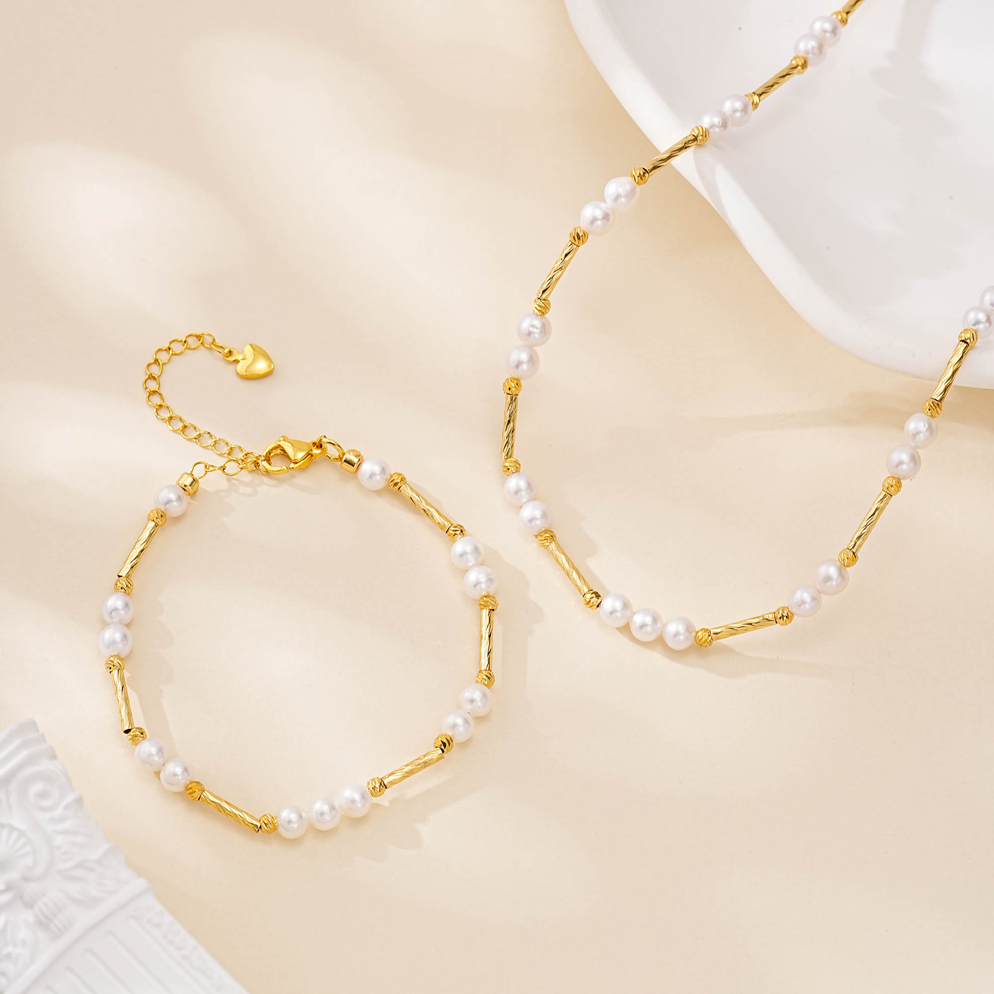 Engraved gold-tone bar and freshwater pearl necklace and bracelet set