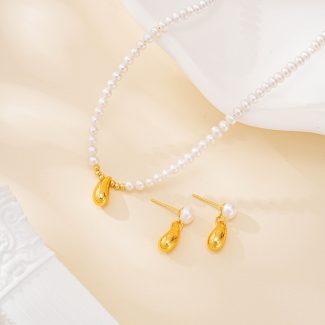 Gold-tone teardrop pearl necklace and matching earrings