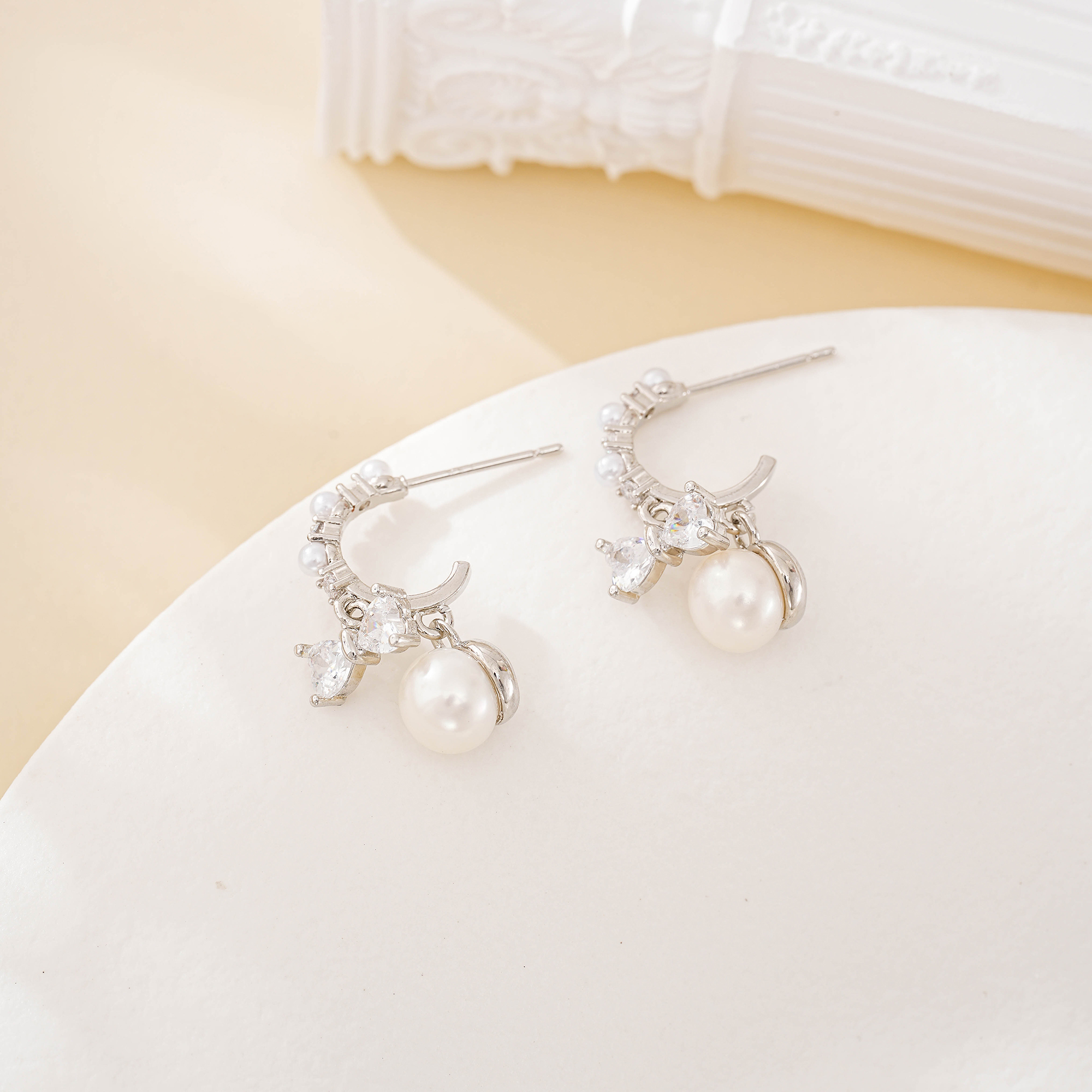 Zircon bow drop earrings with freshwater pearls
