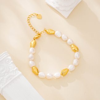 Irregular pearl and faceted gold-tone bead bracelet