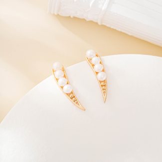 Curved crystal and pearl statement stud earrings