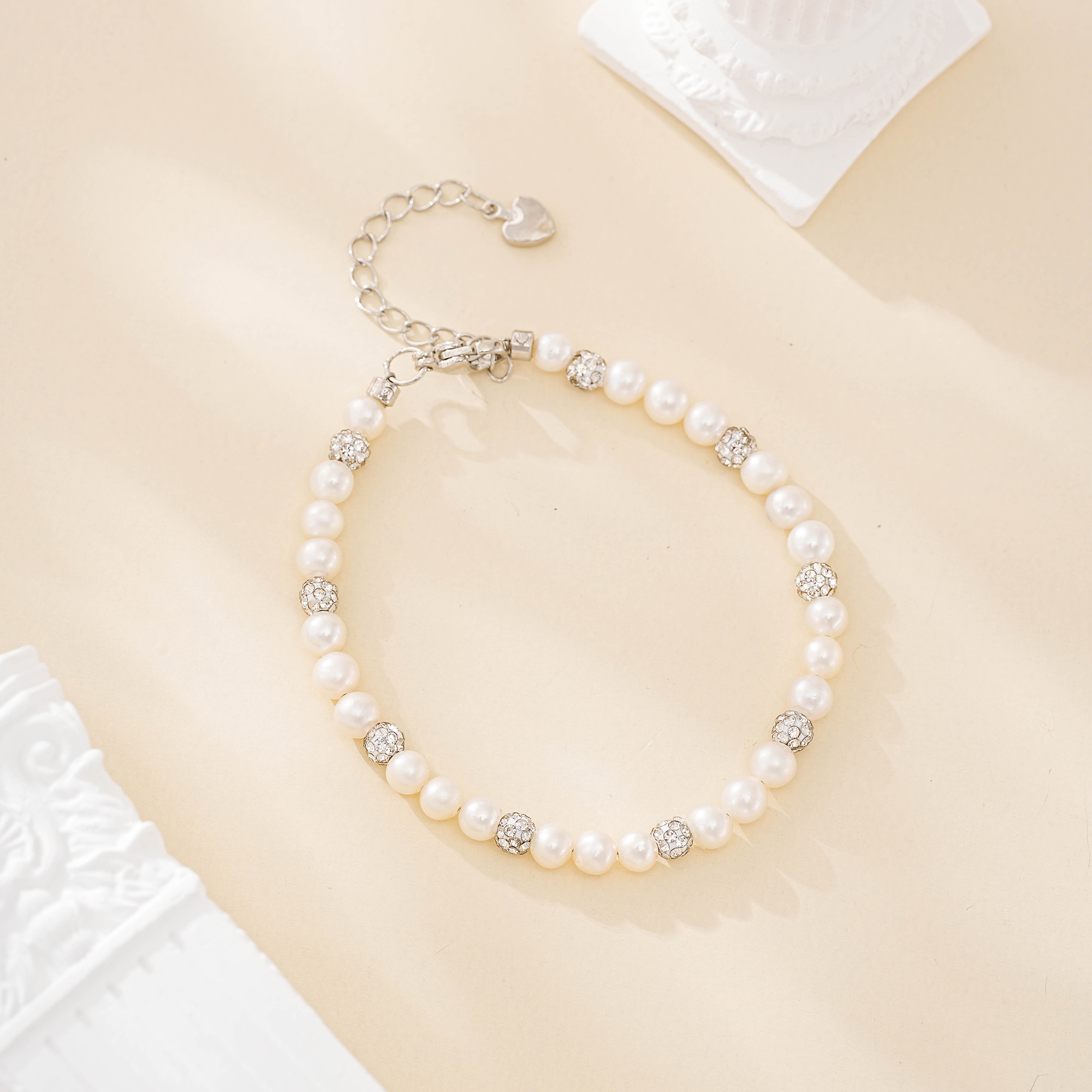 Silver-tone zircon ball and freshwater pearl bracelet