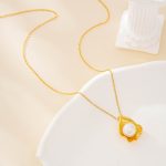 Shell motif baroque pearl pendant necklace