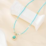 Turquoise beaded pendant necklace with freshwater pearl accents