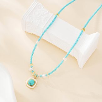 Turquoise beaded pendant necklace with freshwater pearl accents