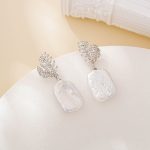 Silver leaf earrings with square baroque pearls