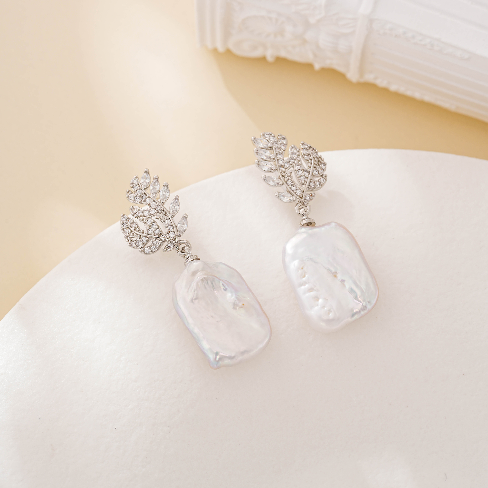 Silver leaf earrings with square baroque pearls