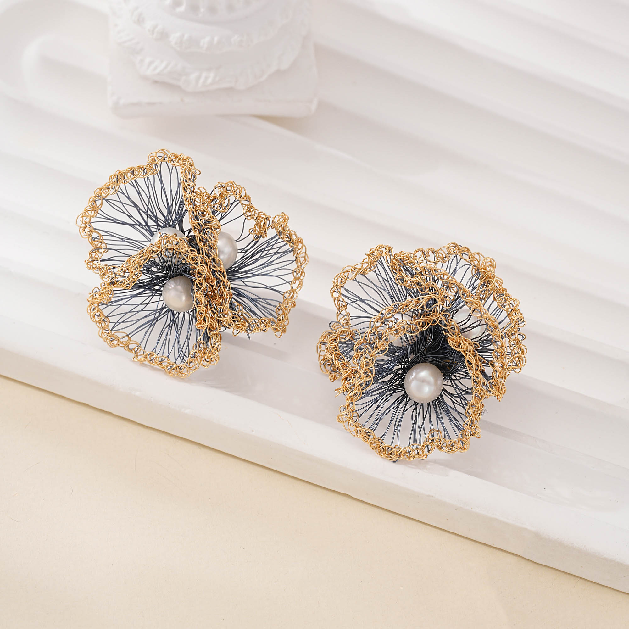 blue wire flower earrings detail