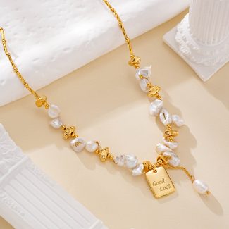 Baroque pearl necklace with Good Luck charm and gold-tone accents