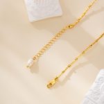 Gold-tone clasp and extender of the Good Luck pearl necklace