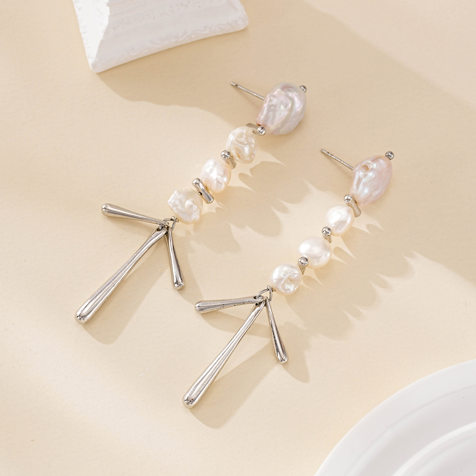 Silver-tone baroque pearl chandelier earrings with tapered drops