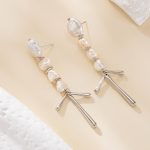 Silver-tone baroque pearl chandelier earrings viewed from the side