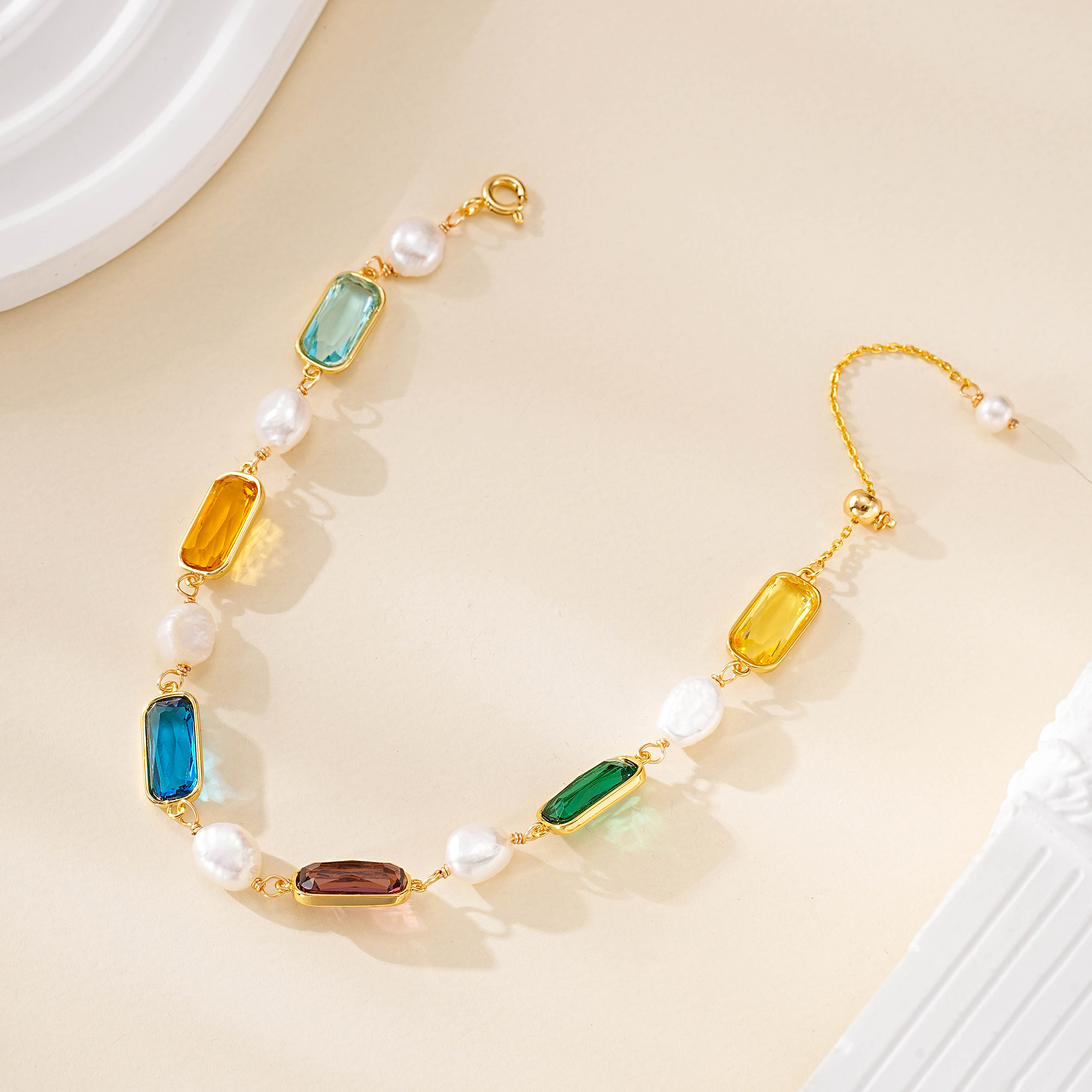 Gemstone and freshwater pearl bracelet shown open with its clasp