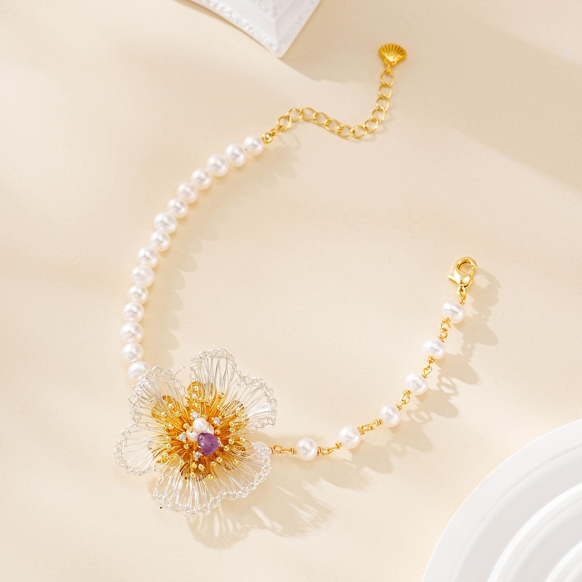 Freshwater pearl bracelet with floral wirework and clasp