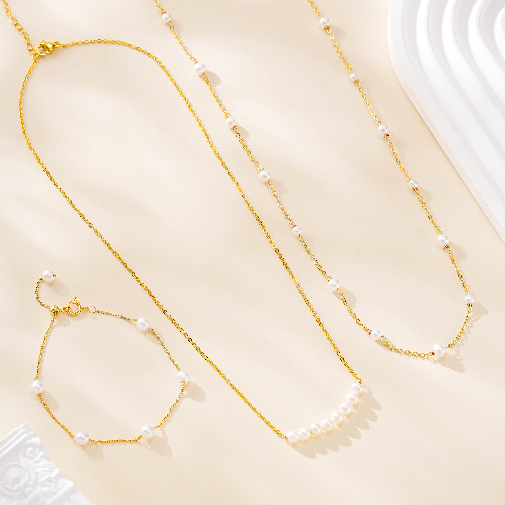 Freshwater pearl bracelet with two coordinating gold-tone necklaces