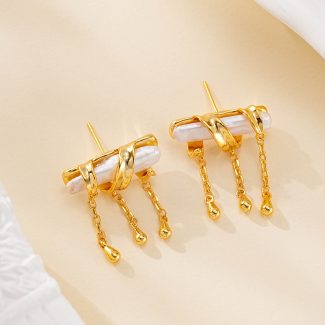 Gold-tone baroque pearl earrings with three short chain drops