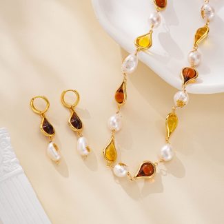 Amber-toned resin and pearl earrings with matching necklace