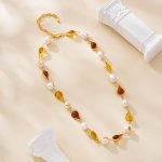 Full view of resin and pearl station necklace