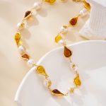 Detail of resin teardrops alternating with pearls on necklace
