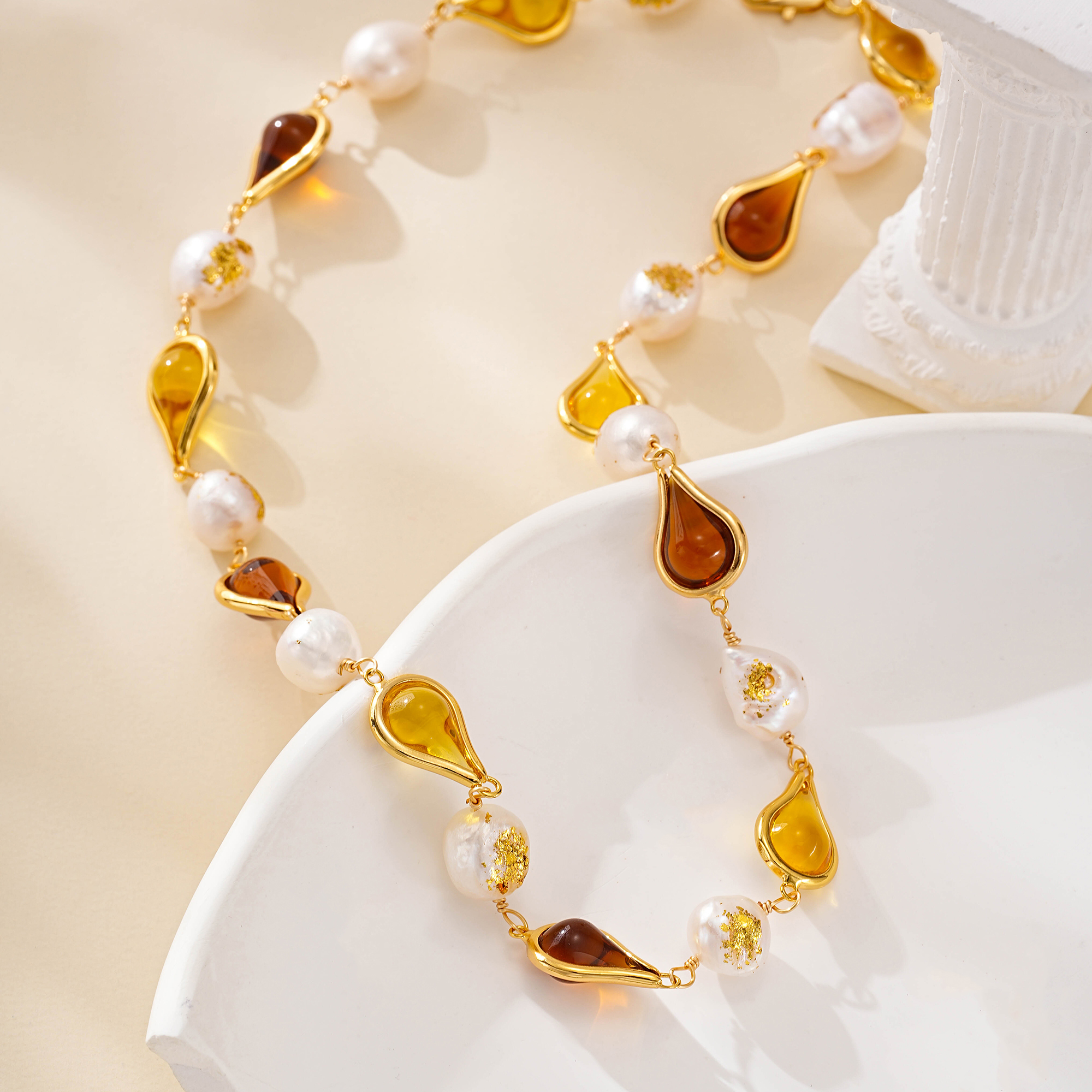 Detail of resin teardrops alternating with pearls on necklace