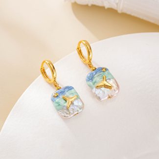 Gold-tone hoops with ocean-painted baroque pearl drops