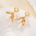 Close view of cascading pearl and metal tassel earrings